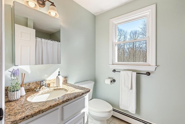 bathroom featuring tile patterned floors, toilet, vanity, and a baseboard heating unit