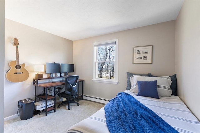 bedroom featuring baseboards, carpet floors, and a baseboard radiator