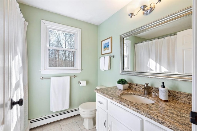 bathroom featuring tile patterned floors, a baseboard radiator, toilet, and vanity