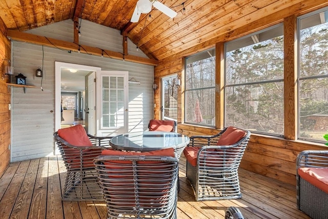 sunroom featuring a wealth of natural light, wooden ceiling, a ceiling fan, and vaulted ceiling