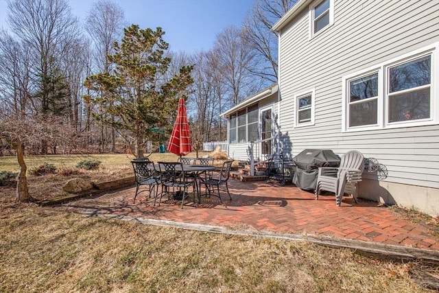 view of patio with a sunroom