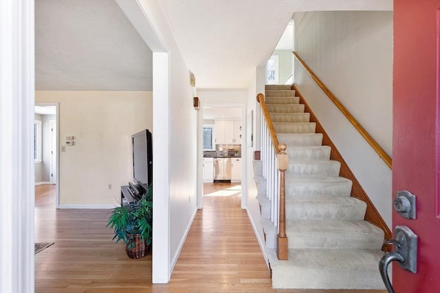 interior space with wood finished floors and baseboards