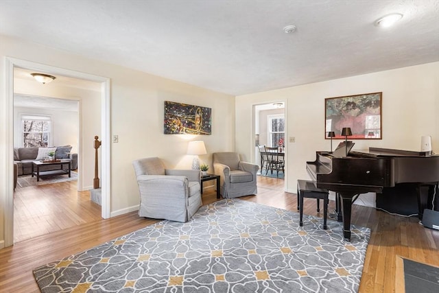 living room with wood finished floors and baseboards