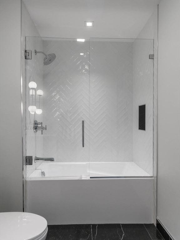 full bath with shower / bath combination with glass door and toilet