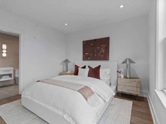 bedroom with wood finished floors