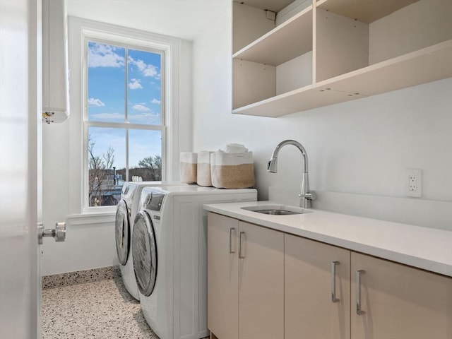 laundry room featuring washing machine and dryer and cabinet space