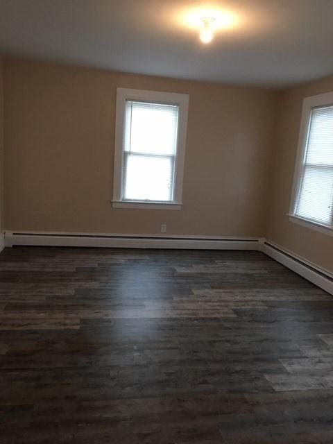 58 Jay St, North Attleboro, MA 02760 - empty room with dark wood finished floors and baseboards