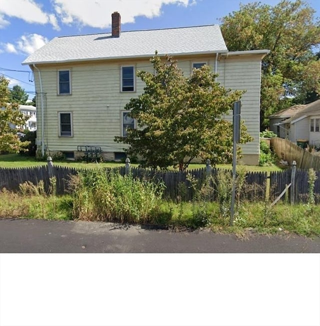 58 Jay St, North Attleboro, MA 02760 - view of side of home featuring a chimney