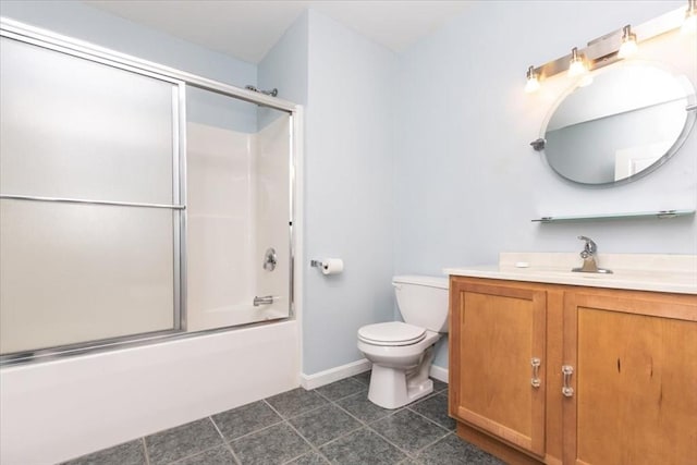 full bathroom with toilet, vanity, bath / shower combo with glass door, baseboards, and tile patterned flooring
