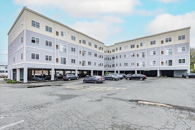 view of property featuring uncovered parking