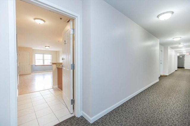 corridor featuring baseboards