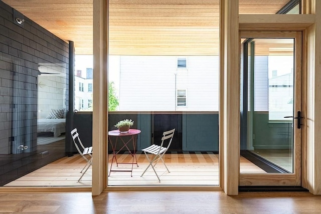 doorway with hardwood / wood-style floors