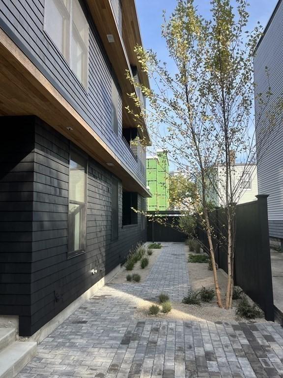 view of side of home with a patio area