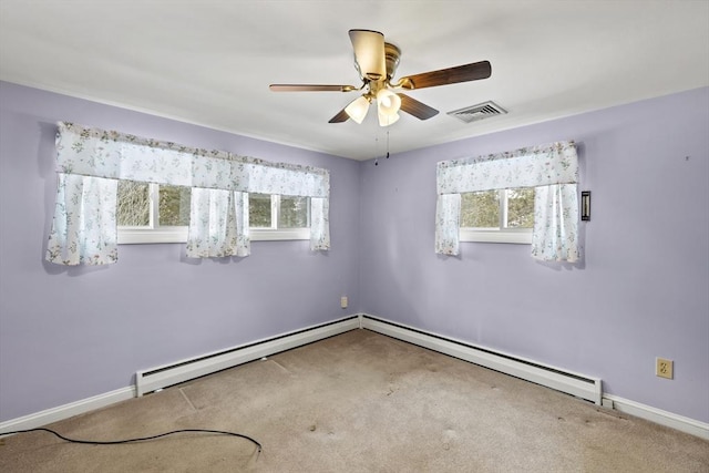 unfurnished room featuring visible vents, carpet flooring, a wealth of natural light, and baseboards