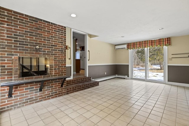 unfurnished living room with light tile patterned floors, wainscoting, a wall unit AC, a baseboard heating unit, and recessed lighting