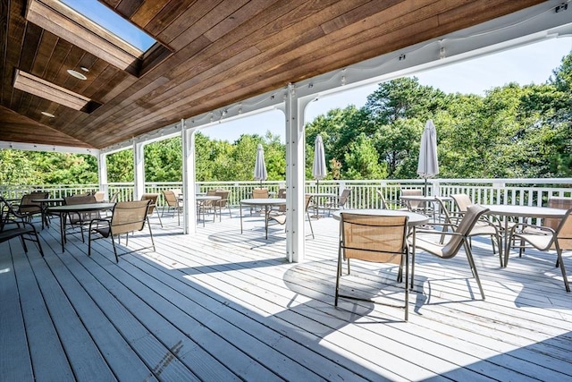 wooden deck featuring outdoor dining space