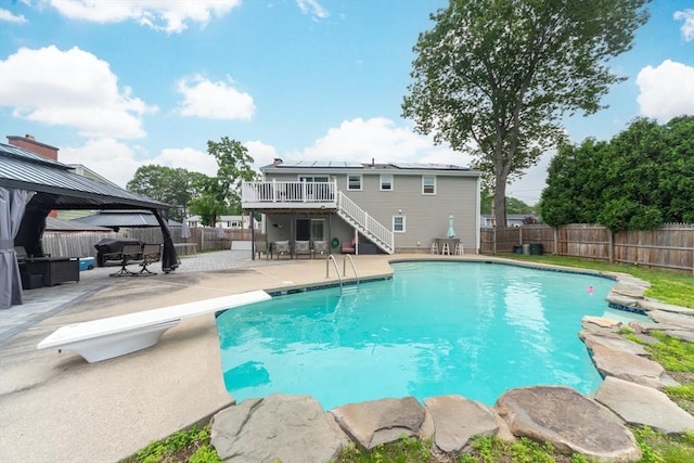 13 Westgate Rd, Framingham, MA 01701 - view of pool featuring a gazebo, stairs, a patio, a fenced backyard, and a deck