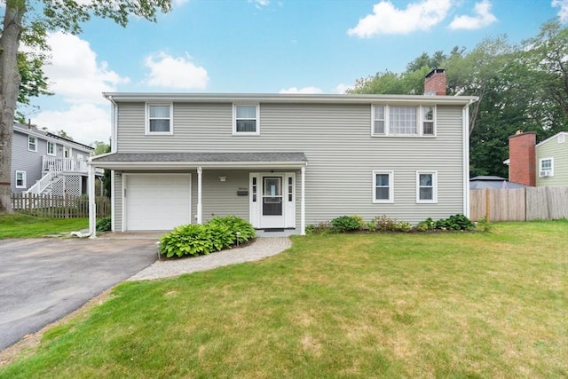 13 Westgate Rd, Framingham, MA 01701 - traditional-style home featuring a chimney, driveway, and an attached garage