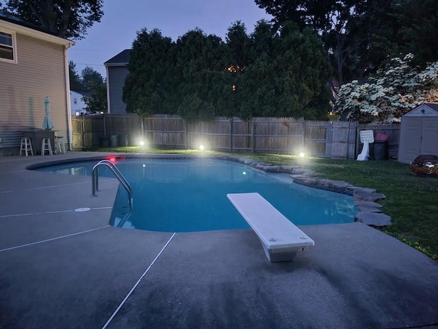 13 Westgate Rd, Framingham, MA 01701 - view of pool featuring a fenced backyard, a storage shed, a diving board, and a patio