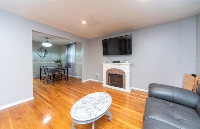 13 Westgate Rd, Framingham, MA 01701 - living area with light wood finished floors, a fireplace, and recessed lighting