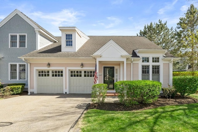 304 Godfrey Dr Unit 304, Norton, MA 02766 - view of front of property featuring a garage, driveway, and a shingled roof