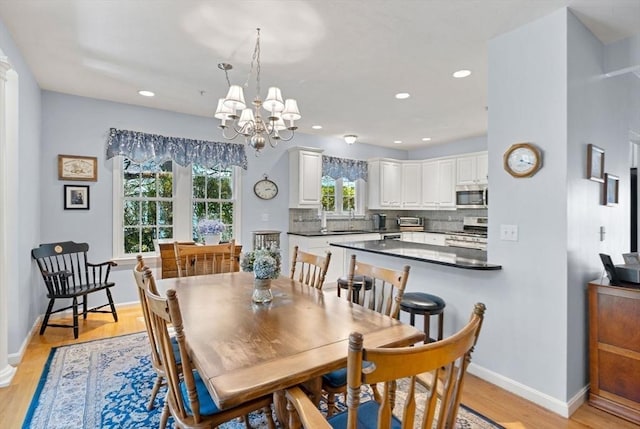 304 Godfrey Dr Unit 304, Norton, MA 02766 - dining room with light wood-style flooring, a chandelier, recessed lighting, and baseboards