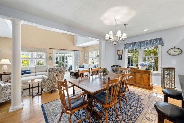 304 Godfrey Dr Unit 304, Norton, MA 02766 - dining space with decorative columns, healthy amount of natural light, and light wood-style flooring