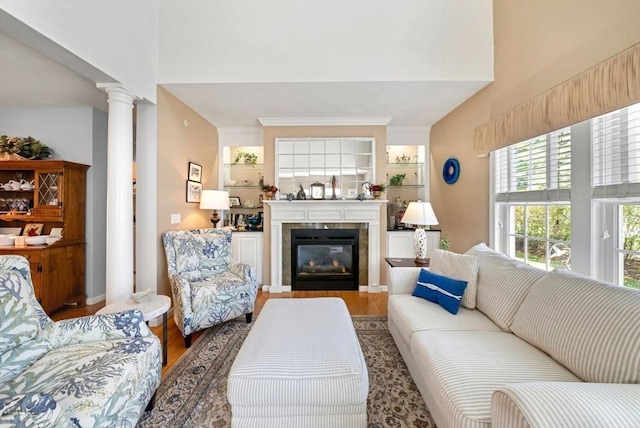304 Godfrey Dr Unit 304, Norton, MA 02766 - living area with wood finished floors, decorative columns, a tile fireplace, and a towering ceiling