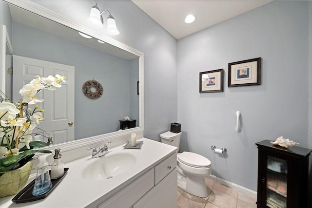 304 Godfrey Dr Unit 304, Norton, MA 02766 - bathroom featuring toilet, vanity, tile patterned flooring, and baseboards
