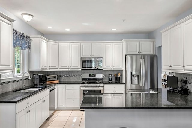 304 Godfrey Dr Unit 304, Norton, MA 02766 - kitchen with appliances with stainless steel finishes, a sink, white cabinets, a peninsula, and recessed lighting