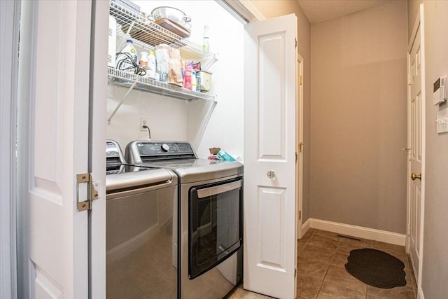 4 Rose Court Way Unit 4, Walpole, MA 02032 - laundry room featuring washing machine and dryer, light tile patterned floors, and baseboards