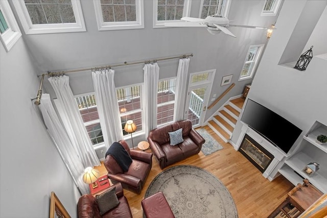 4 Rose Court Way Unit 4, Walpole, MA 02032 - living room featuring a high ceiling, wood finished floors, healthy amount of natural light, and ceiling fan