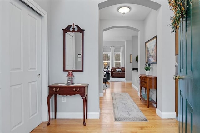 4 Rose Court Way Unit 4, Walpole, MA 02032 - foyer entrance featuring arched walkways, light wood finished floors, and baseboards