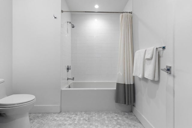 bathroom with tile patterned flooring, toilet, and shower / tub combo with curtain