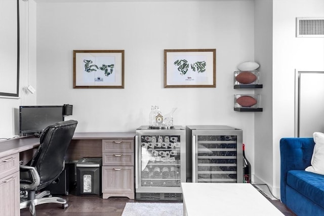 home office featuring wine cooler and dark hardwood / wood-style flooring