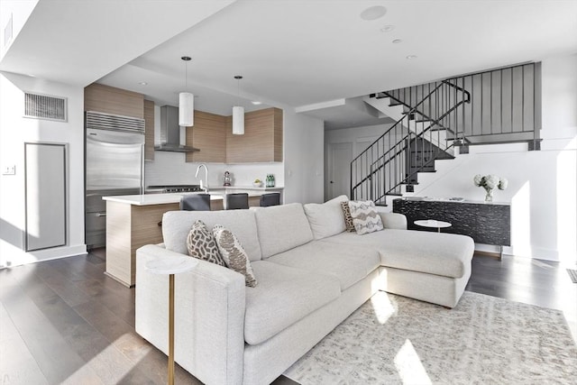 living room featuring dark wood-type flooring