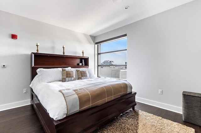 bedroom featuring dark hardwood / wood-style flooring