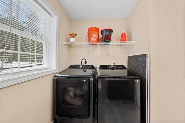 laundry room with laundry area and separate washer and dryer