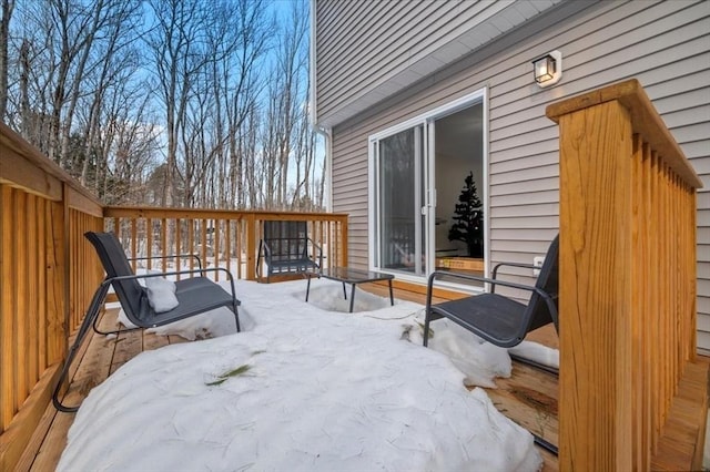 view of snow covered deck