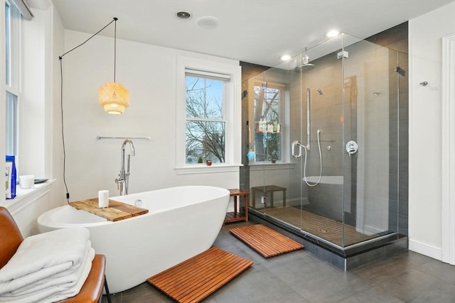 full bath featuring a soaking tub, baseboards, recessed lighting, and a stall shower