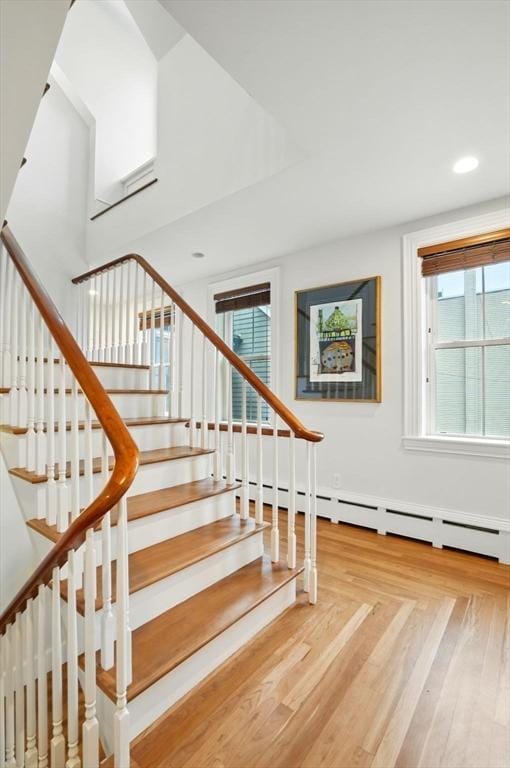 staircase featuring a wealth of natural light and recessed lighting