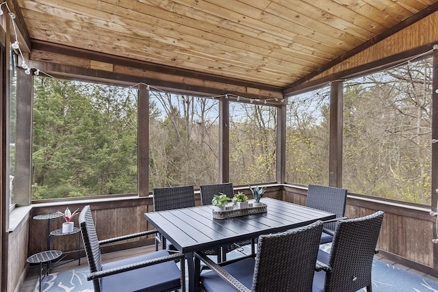 sunroom with plenty of natural light and outdoor dining space