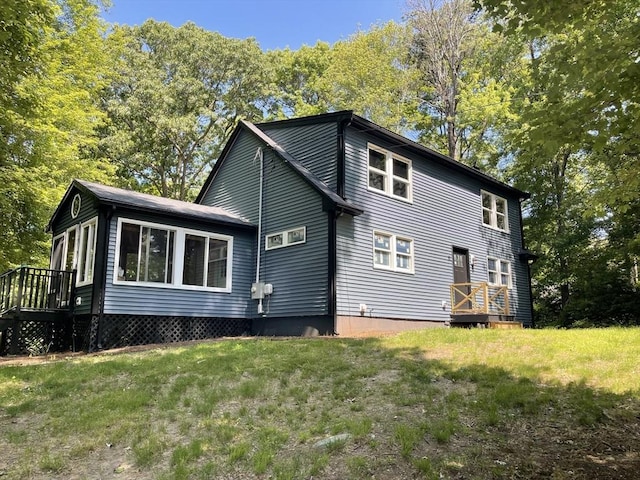 11 Pleasant St, Freetown, MA 02702 - view of home's exterior with a lawn and a wooden deck