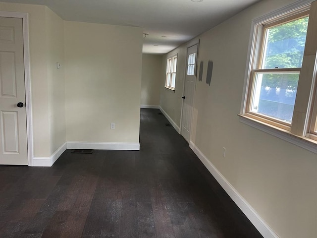 11 Pleasant St, Freetown, MA 02702 - spare room featuring baseboards and dark wood-style floors