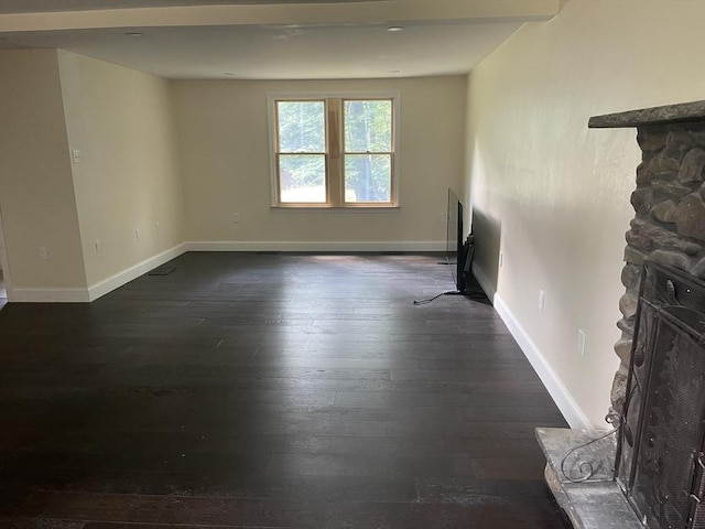 11 Pleasant St, Freetown, MA 02702 - unfurnished living room with dark wood-style flooring and baseboards