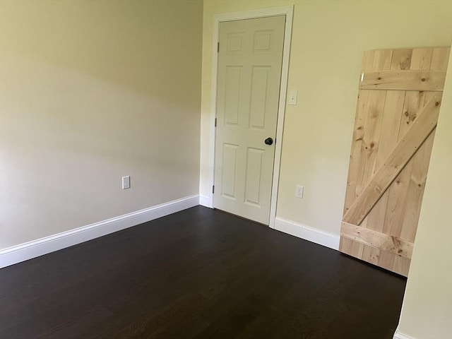 11 Pleasant St, Freetown, MA 02702 - unfurnished room with dark wood-type flooring