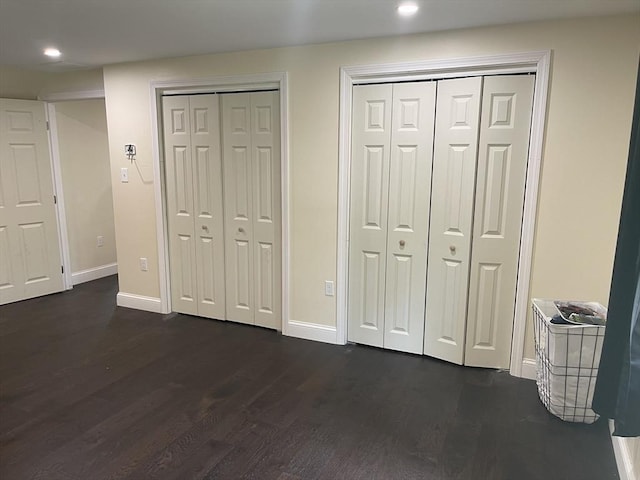 11 Pleasant St, Freetown, MA 02702 - unfurnished bedroom featuring two closets, dark wood-style flooring, and recessed lighting