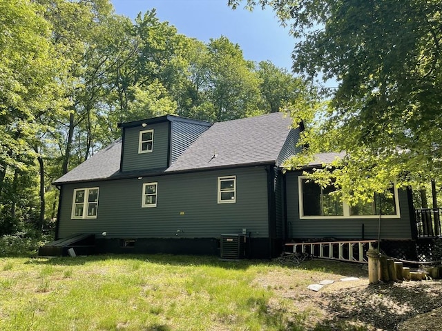 11 Pleasant St, Freetown, MA 02702 - rear view of house featuring a lawn and a shingled roof