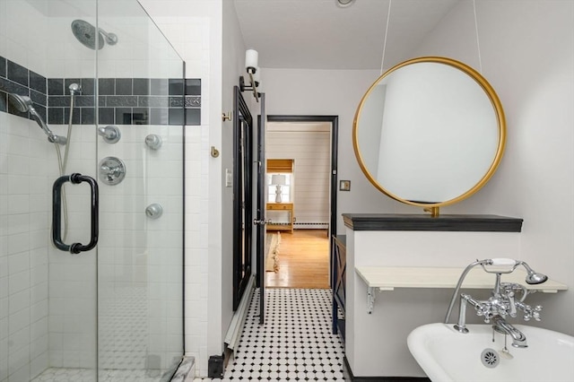 bathroom featuring a shower with shower door