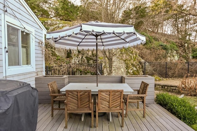 wooden terrace with grilling area